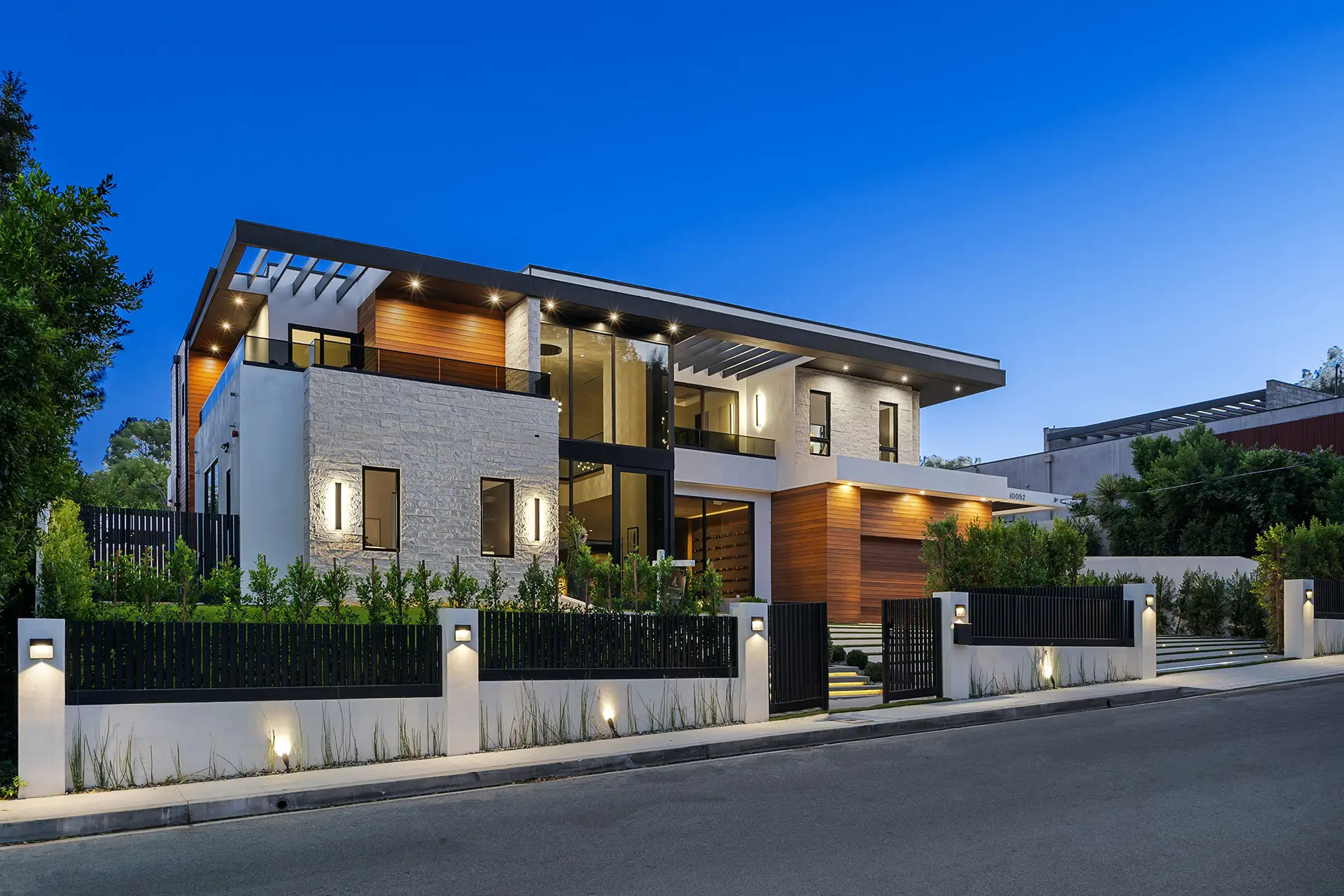 modern two story house with illuminated